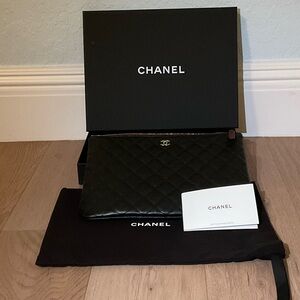 CHANEL Elegant Black Quilted Clutch